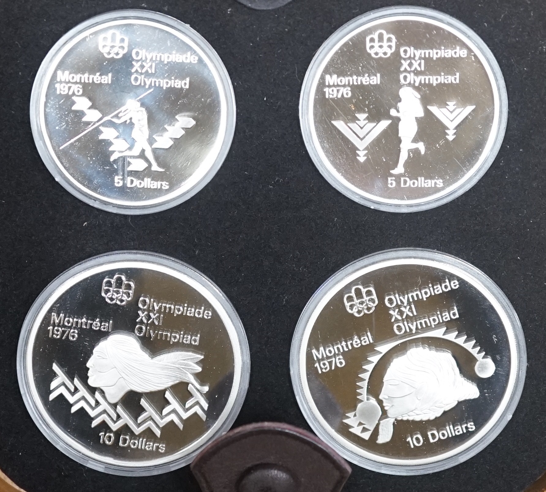 Seven cased 1976 Olympiad Montreal sets containing proof silver 5 dollar (x2) and 10 dollar (x2)